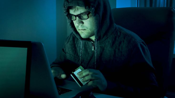 a man on a computer reporting fraud