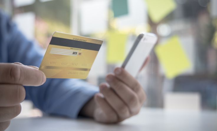 Man inputting card details into phone